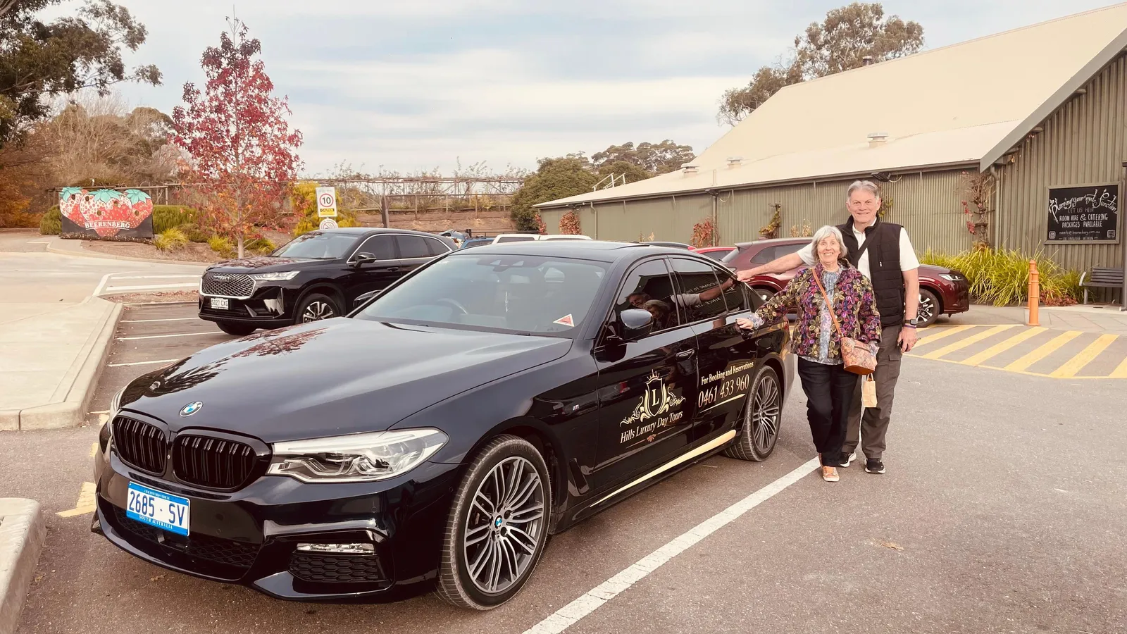 The black tour sedan in a cellar door car park