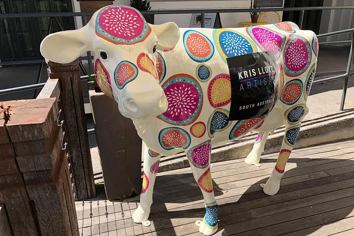 A painted cow sculpture outside the Woodside cheese cellar