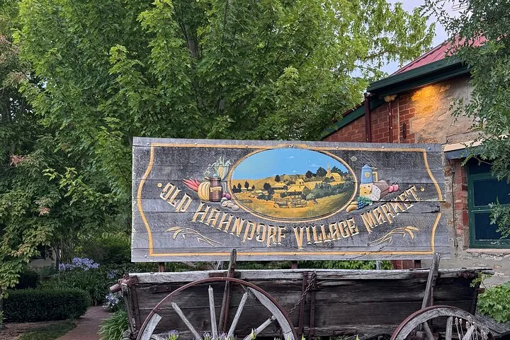 The Old Hahndorf Village Market sign on a wooden cart