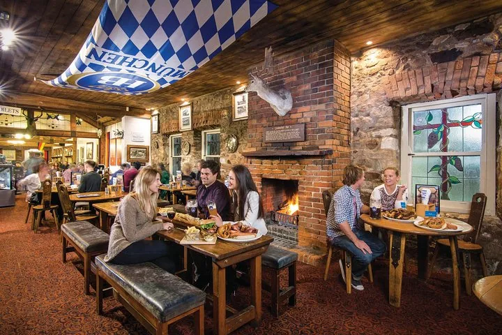 A German-style pub dining room with a log fire