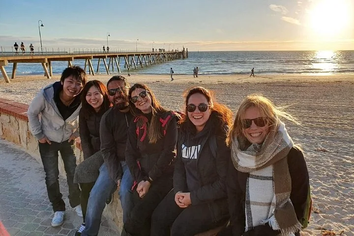 The tour group on Glenelg beach at sunset by the jetty