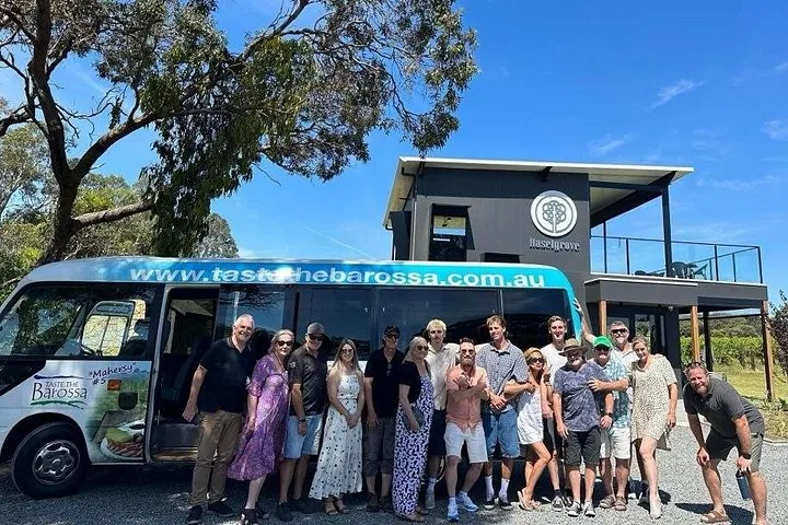 The tour minibus and group outside a cellar door